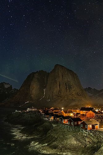 Norway- Lofoten Islands. Aurora Borealis In the sky above Hamnoy in Reine Art Print